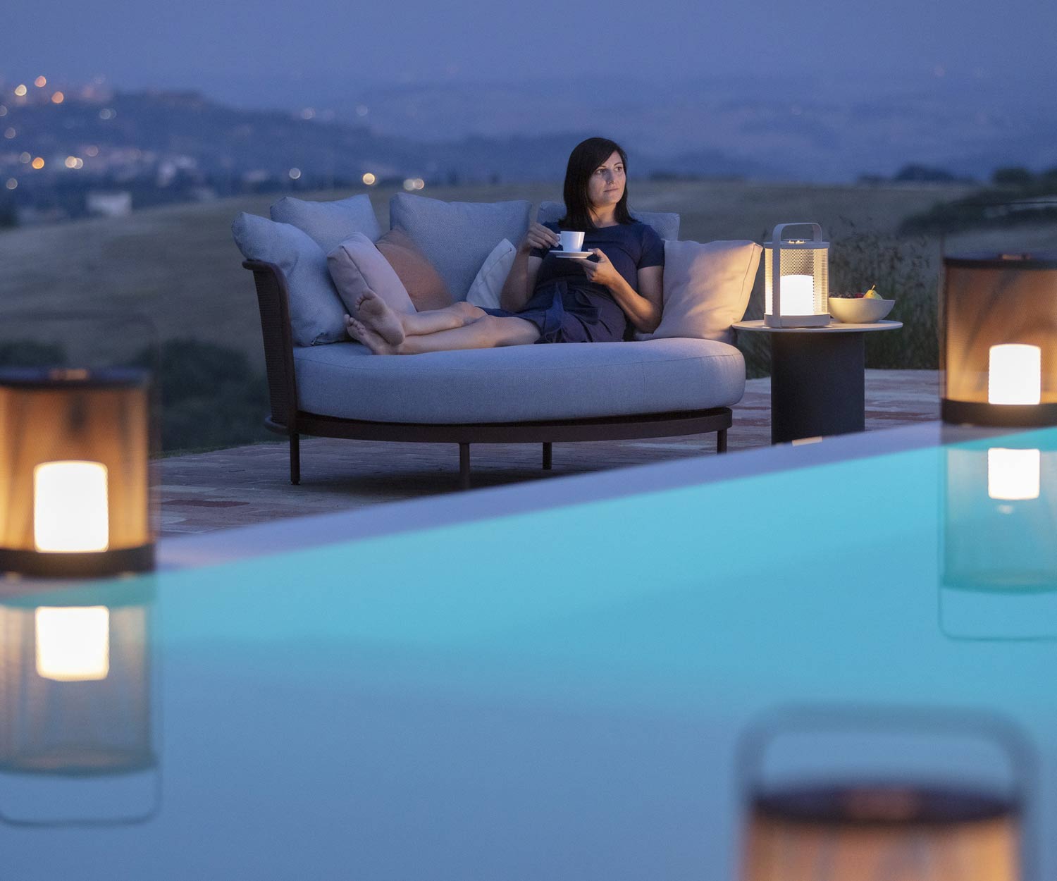 Evening atmosphere at the terrace pool with lighting and Baza daybed