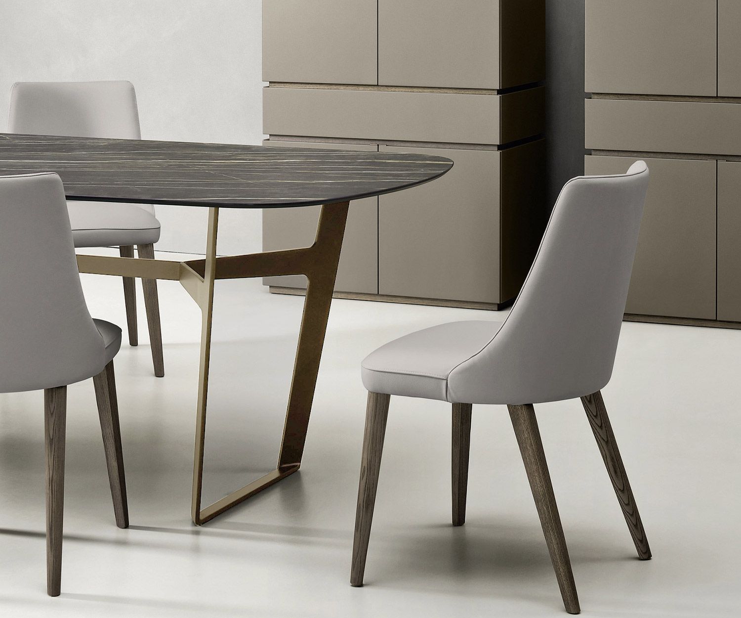 Livitalia Obi designer table in detail metal frame in brown with dining table chairs in front of 2 highboards