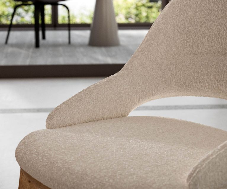 Modern upholstered chair with beige leather and brown oak frame