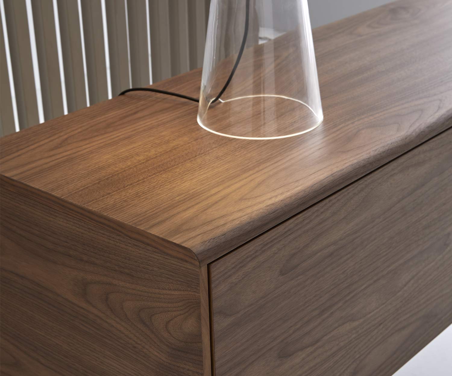 Exclusive design sideboard detail top with rounded edge in walnut