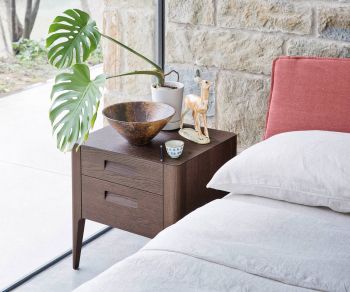 Giotto designer bedside table with oak finish Novamobili next to bed