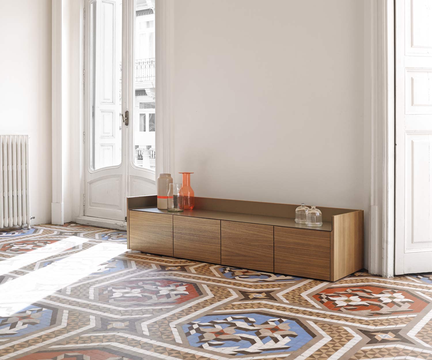 High-quality design sideboard with walnut veneer standing on low legs